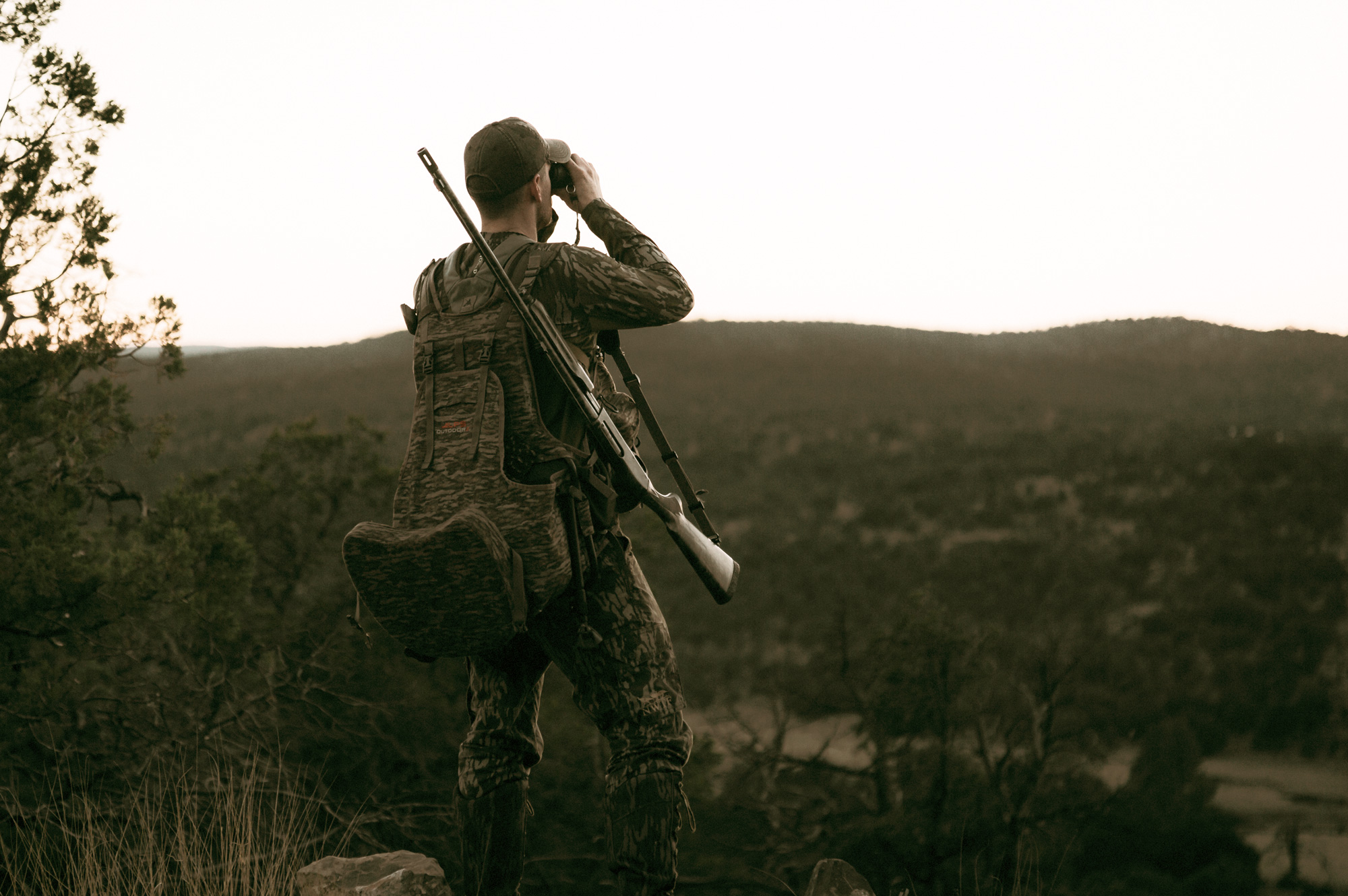turkey hunter scouting woods in new mexico