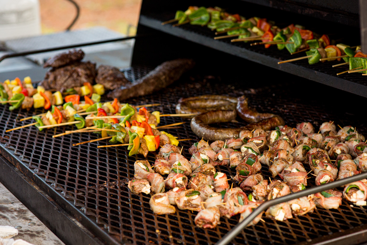 array of wild game on a grill