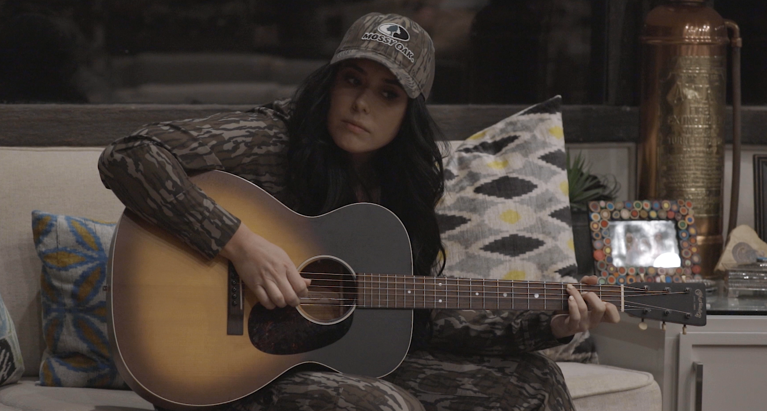 girl playing a guitar