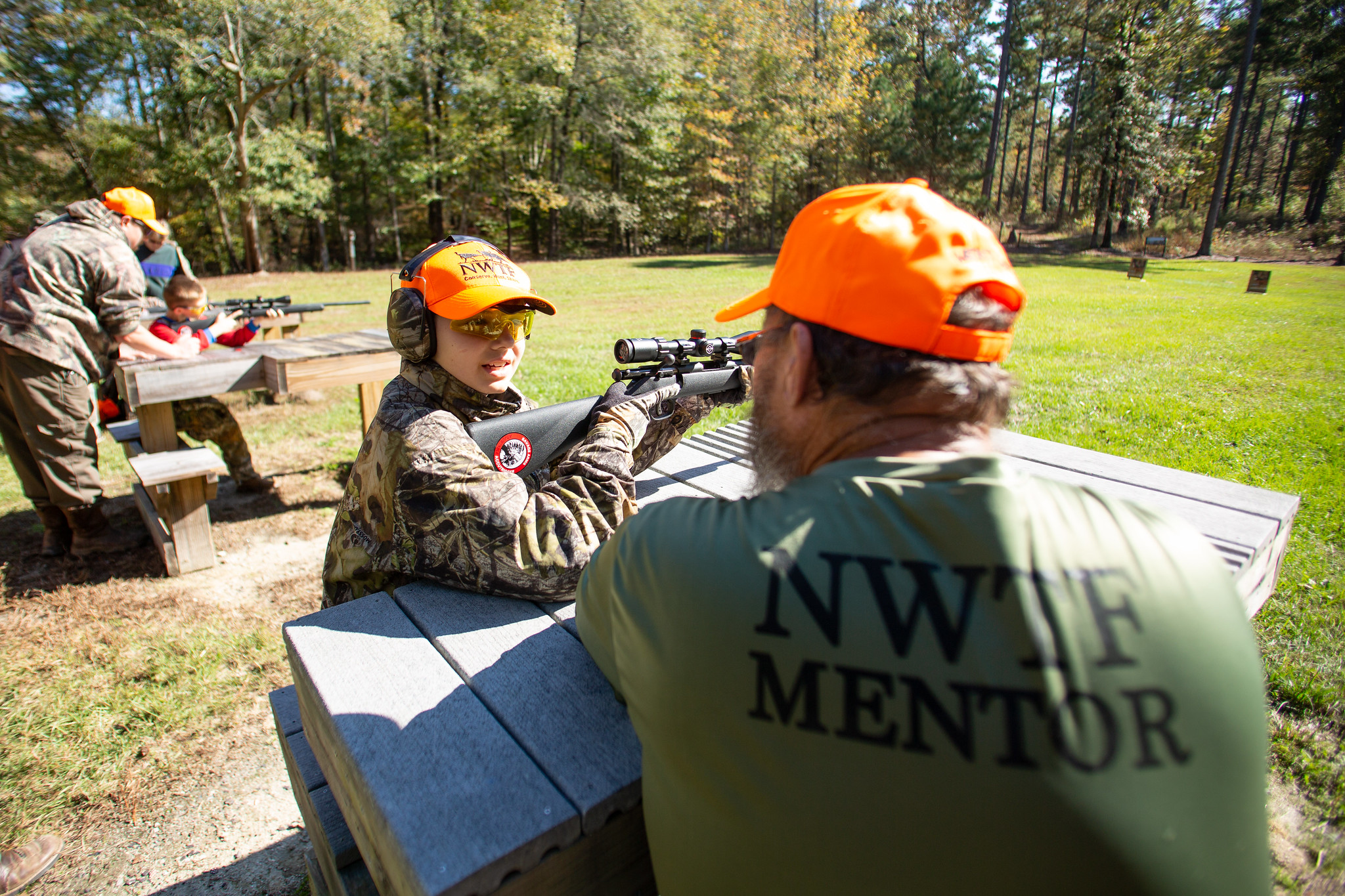 nwtf mentor teaching youth about firearms