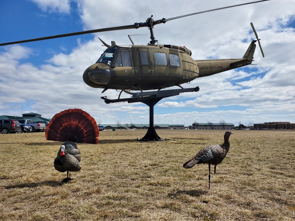 turkey decoys set up in front of a helicopter