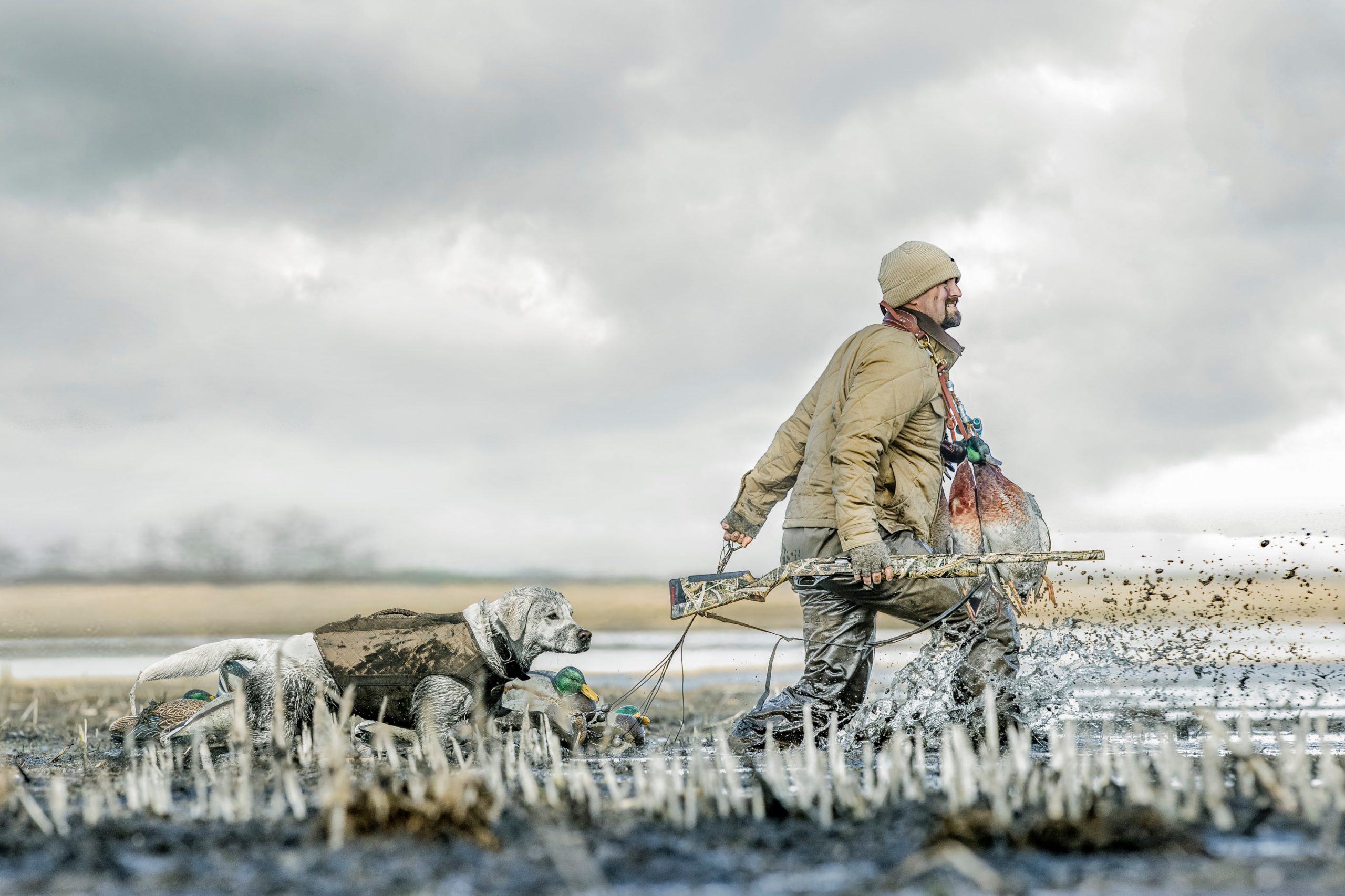 waterfowl hunter with his faithful hunting dog