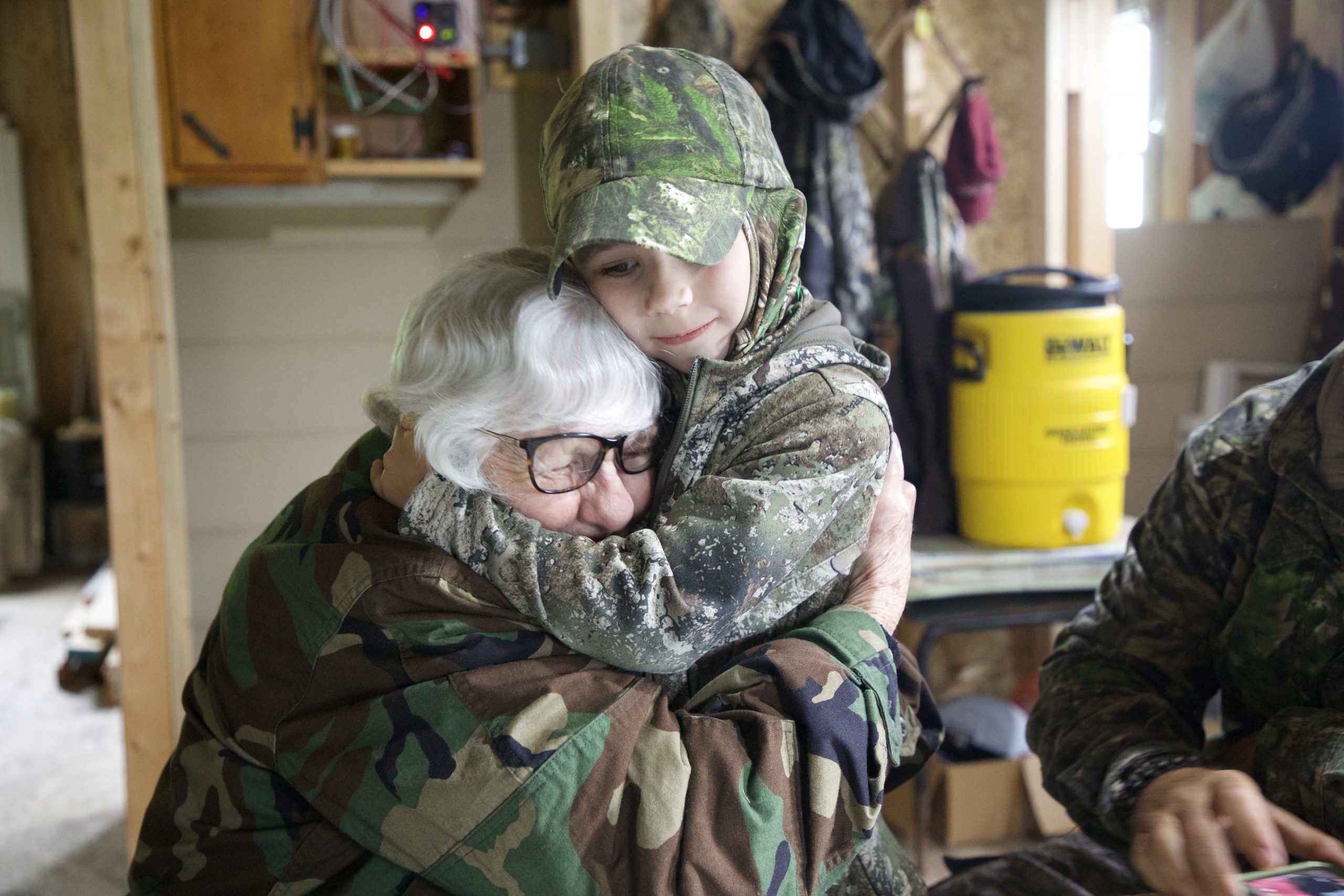 Gwen and her great grandson hug each other after a turkey hunt.
