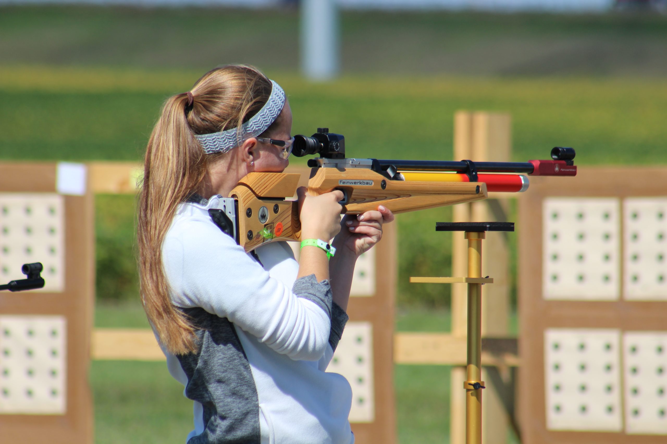 young girl competes with air rifle