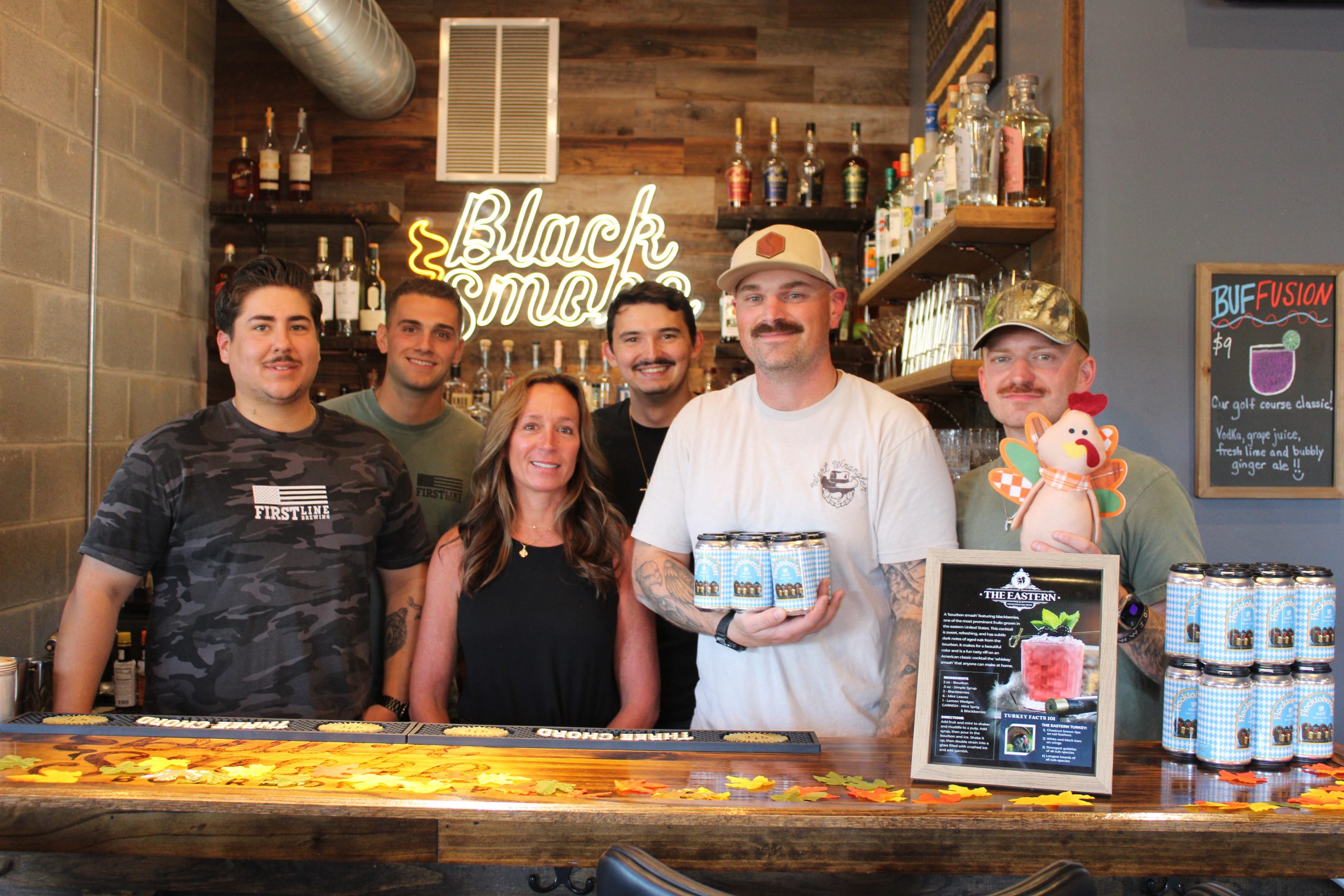 First Line Brewing Staff with Flocktoberfest beer cans