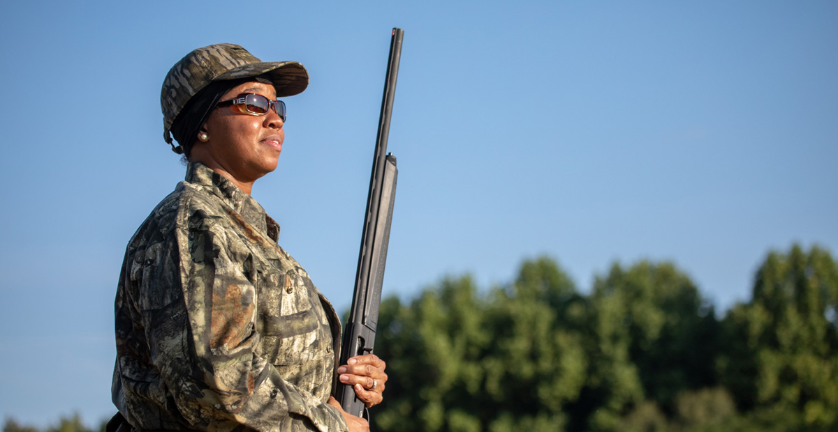 Female hunter in a dove field